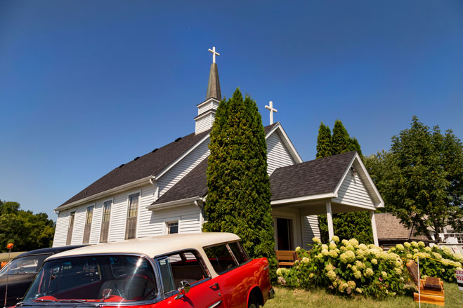 Church from Side with classic cars parked by it