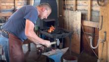 Blacksmith demonstrating his craft