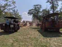 Two steam engines threshing